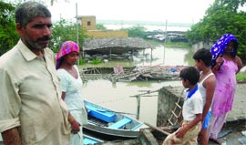 Residents of the village see the rising river.