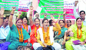 Uttarakhand Kranti Dal workers hold a dharna in Dehradun on Tuesday.