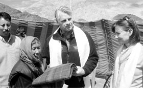 US Ambassador Timothy J. Roemer and Mrs. Sally Roemer distribute blankets as part of the US relief for flood victims in the Leh region on Tuesday
