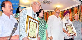 The Editor-in-Chief, The Tribune Group of Newspapers, Raj Chengappa, addresses a function to honour journalists in Chandigarh on Tuesday; and (R) CM Bhupinder Singh Hooda with Manmohan Sharma, NS Parwana and BK Chum, who were honoured with the Lifetime Achievement Award.