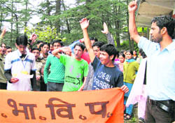 Activists of the ABVP shout slogans against the poor infrastructure in Sanskrit College and substandard material being provided by college canteen in Shimla