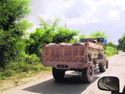 A truck carries stones for quarrying on the Panjhera-Nava Garam road in Nalagarh area