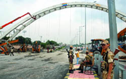 Security personnel at the site of the collapsed foot overbridge in New Delhi