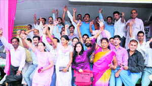   Members of the Gram Pardhan Sangathan hold a protest in front of the Vidhan Sabha in Dehradun on Wednesday.