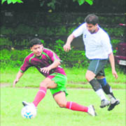 Players vie for the ball in a match of the Stephen Hishey Memorial Football Tournament at the Pavilion Ground in Dehradun on Wednesday.