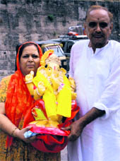 Devotees at Har-ki-Paudi in the Tawi river for immersing the statue of Lord Ganesha in Jammu on Wednesday