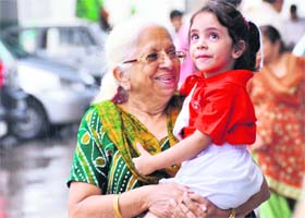 A girl enjoys the company of her grandmother on their way to BCM Arya Senior Secondary School in Ludhiana