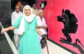 Old-age home inmates come out of a multiplex after watching the Punjabi movie ‘Ik Kudi Punjab Di’ in Ludhiana