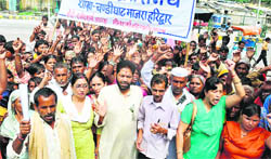 Flood-affected persons protest at the City Magistrate Office in Haridwar