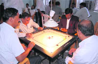 A match in the Bar Association Carrom Tournament under way in Dehradun 