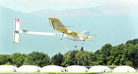 Solar Impulse's Chief Executive Officer and pilot Andre Borschberg lands the solar-powered HB-SIA prototype at Cointrin International airport in Geneva September 21, 2010. The plane landed for the first time on a commercial airport, causing air traffic to he halted for 20 minutes to avoid turbulence. 