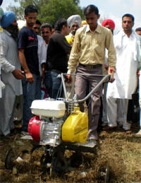A man demonstrates a cultivator during the Kisan Mela in Bathinda on Friday