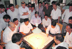 A match in the Bar Association Carrom Tournament being played in Dehradun on Friday.