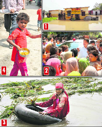 1) A school that was under eight feet of water still unapproachable in Dallawala village; 2) Flood-hit villagers surround Haridwar Parliamentarian Harish Rawat; 3) A girl rides a tyre tube in Gangdaspur Chota village; and 4) A girl with a bowl of rice which was provided by residents of Mangalore in Laksar on Friday.