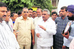 Haridwar legislator Madan Kaushik inspects a flood-hit area of Haridwar