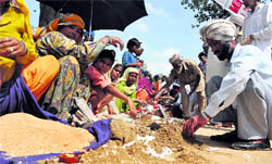Devotees scoop out earth outside Guga Marhi at Chhapaar Mela on Friday
