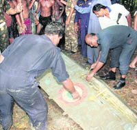 IAF officers inspect the remains of a MiG-27 near Narayangarh in West Midnapore district of West Bengal on Friday.