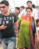 Unable to hide their excitement, a successful couple from Ambala, who got a plot in the 500 sq yard defence category, leaves the venue after the draw of lots in Mohali 