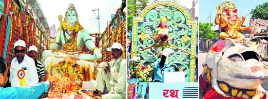Tableaux of deities being taken out in a procession during the immersion journey of ashes of unclaimed bodies in Haridwar