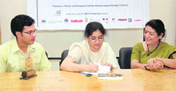 Daman Singh, daughter of Prime Minister Manmohan Singh, signs childrens books at Ghummakad Narain in Dehradun