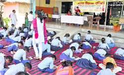 Children paint on environment issues during a competition in Haridwar