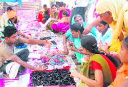 Women buying knick knacks at the Chappar mela, which is continuing even after its formal closure on Saturday. 