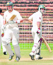 Australian opener Shane Watson and Simon Katich steal a run during the practice match between Board President XI and Australia in Chandigarh on Saturday. 