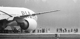 Passengers are evacuated from a Pakistan Airlines jet that landed at the Arlanda airport near Stockholm following a bomb threat