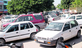 Vehicles parked haphazardly at the Phase VII market in Mohali