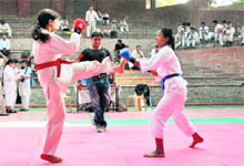 A bout at the Fifth District Karate Competition in Dehradun on Sunday.