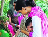 Vedo Devi, mother of the victim, wails outside the Civil Hospital in Karnal on Sunday.