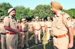 Where is your baton inspector? The SSP, Naunihal Singh, asks inspector Jaswinder Singh about his baton at the time of the parade in Chandigarh