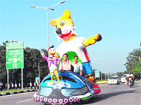 College students with Commonwealth Games mascot Shera promote the game in Chandigarh.