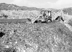 JCB machines clear garbage from the dumping site at Sector 23, Panchkula,