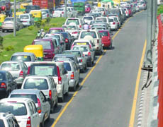 The 8 am-8 pm lane restriction caused traffic to move at a snails pace in New Delhi on Monday.