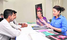 Students take information from representatives of New Zealand University in Dehradun