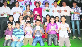 Child vocalists with chief guest Laxmi Shankar Vajpayee at the release of an album in Rewari.