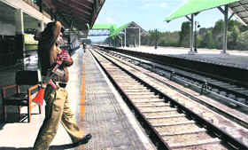 A securityman stands guard at a deserted railway platform on the outskirts of Srinagar on Monday.