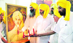 Members of the Shaheed Bhagat Singh Club pay tributes to the martyr on his birth anniversary in Ludhiana on Monday. 