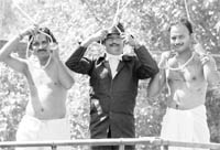Youths enact the hanging of Shaheed Bhagat Singh, Rajguru and Sukhdev during a procession at Dera Bassi on Monday. 