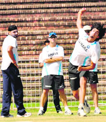 Ishant Sharma practises while Harbhajan Singh and coach Gary Kirsten look on at Cricket Stadium, Sector 16, Chandigarh, on Tuesday.