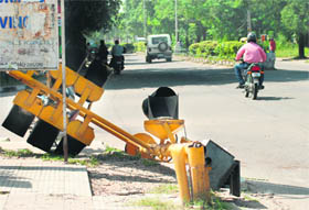 A light pole lying on a road separating Phases IV and V in Mohali.