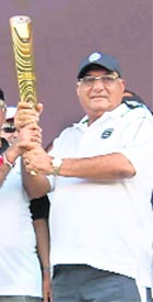 Chief Minister BS Hooda with the Queens Baton in Rohtak on Tuesday.