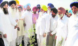 Minister for tourism Hira Singh Gabria discusses a point about the Bara Ghallughara memorial with delegates at Rohira near Ahmedgarh on Tuesday.