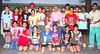 Winners of the Prithipal Singh Memorial Open Table Tennis Tournament strike a pose with their trophies in Ludhiana on Tuesday.