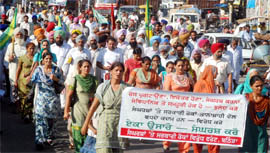 Members of various farmer, labourer and employee organisations holding a joint protest march in support of their demands in Bathinda on Wednesday