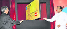OP Bhatt, CMD of State Bank of India, with Home Minister P Chidambaram at the launch of Para Military salary package by the SBI, a specially designed bundle of products and services for the personnel of the Central forces in New Delhi on Wednesday.