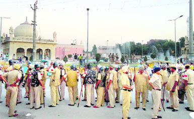 The police stages a flag march in Karnal 