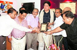 Prof Rajinder Bhandari, vice-chairman, Punjab State Planning Board (centre), being honoured at Kamla Lothia SD College in Ludhiana on Wednesday