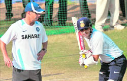 Indian cricket coach Gary Kirsten oversees Virender Sehwags tecnhique during a training session in Mohali on Wednesday.